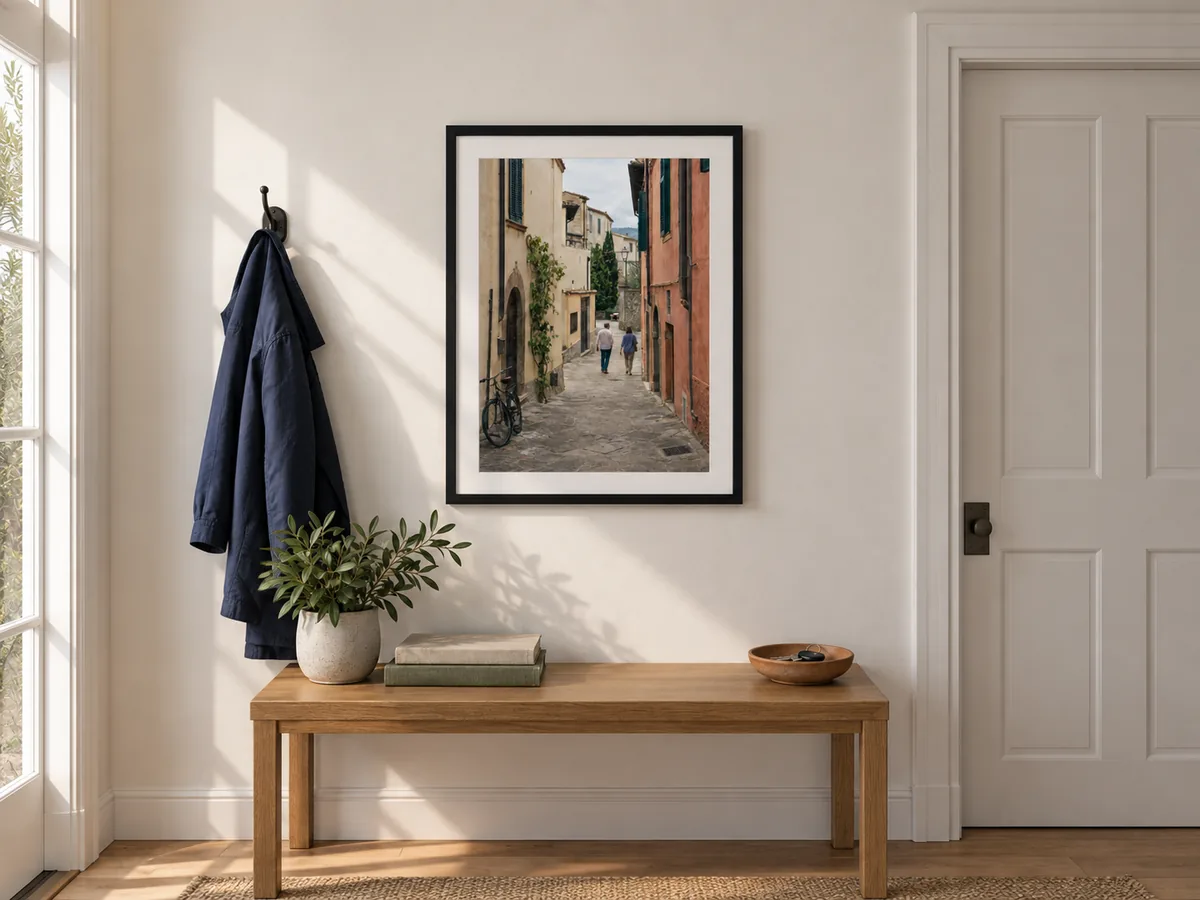 The Italian street photo in a black frame above an entryway console